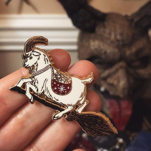 White Yule Goat on Broom Enamel Pin